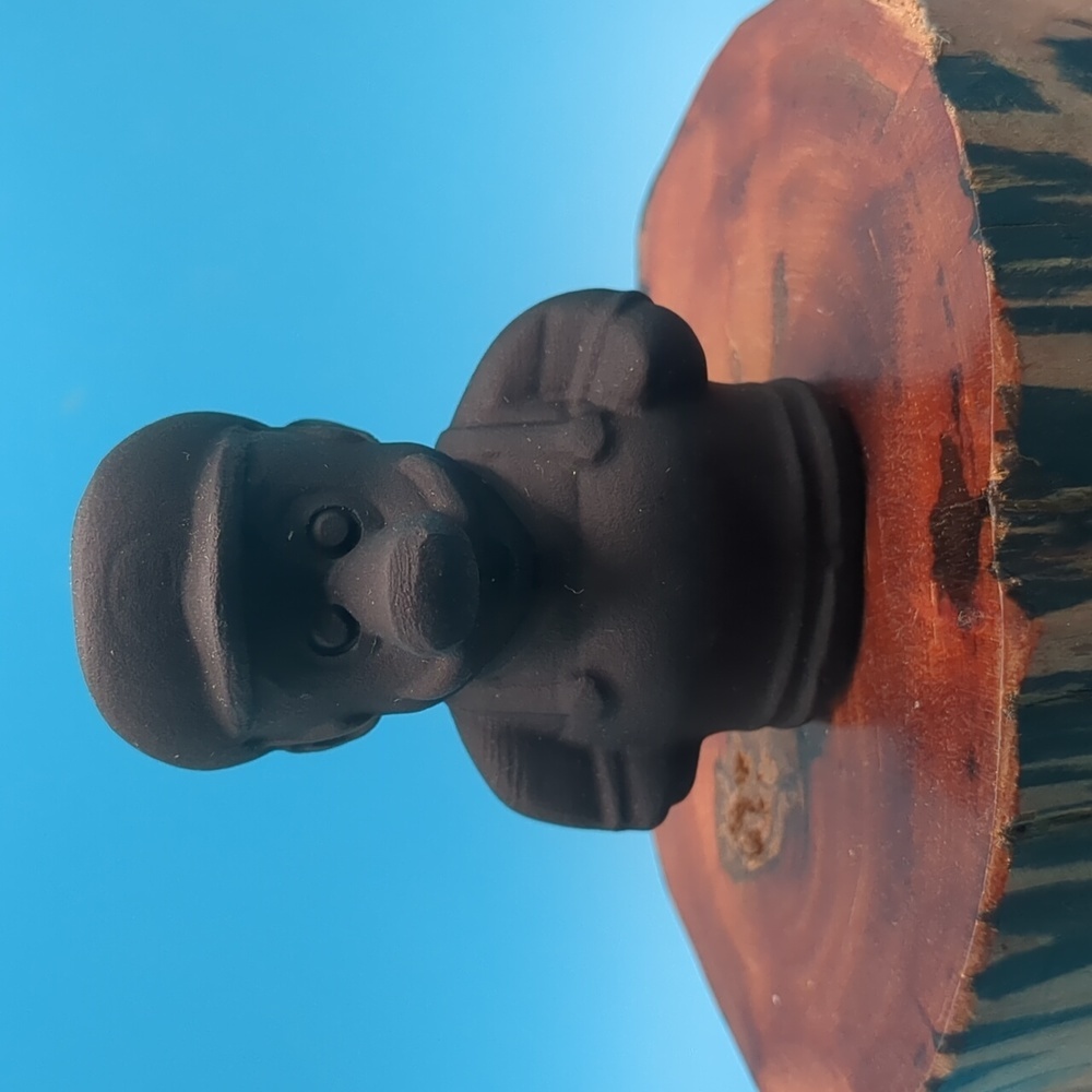 Hand carved obsidian Super Mario